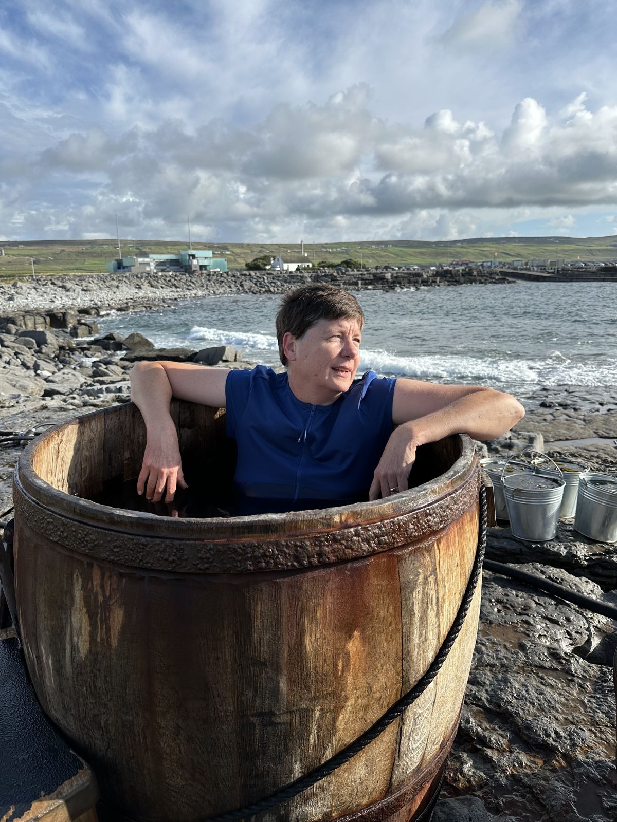 Dana in a wooden seaweed bath tub on the Irish coast