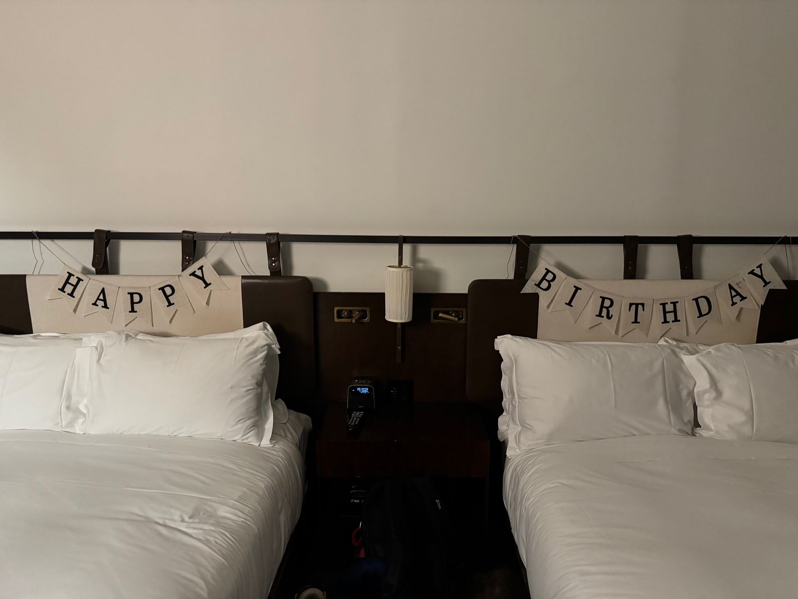 A New York hotel room decorated with a Happy Birthday banner