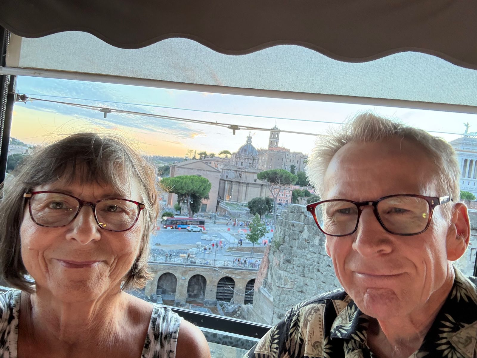 Meryl and her husband on a rooftop overlooking the Roman Forum